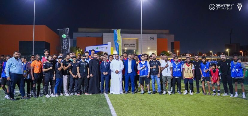 With a delegation at a football event